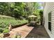 Well-maintained wood deck perfect for outdoor dining and relaxation, surrounded by mature trees and landscaping at 5404 Trumpet Vine Se Trl, Mableton, GA 30126
