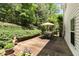 Backyard features a wooden deck with outdoor table and chair set at 5404 Trumpet Vine Se Trl, Mableton, GA 30126