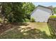 Well-maintained backyard with plenty of space for outdoor activities, surrounded by mature trees and a privacy fence at 5404 Trumpet Vine Se Trl, Mableton, GA 30126