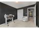 Bedroom featuring a closet, dark walls, and access to an upstairs hallway at 5404 Trumpet Vine Se Trl, Mableton, GA 30126
