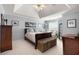 Spacious bedroom featuring a vaulted ceiling, recessed lights, and a comfortable sitting area at 5404 Trumpet Vine Se Trl, Mableton, GA 30126