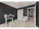 Bedroom featuring a black accent wall, and double door closet with a glimpse of hall at 5404 Trumpet Vine Se Trl, Mableton, GA 30126