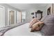 Spacious bedroom with a four-poster bed and decorative pillows at 5404 Trumpet Vine Se Trl, Mableton, GA 30126
