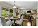 Cozy dining area with access to outdoor patio and open view to living area at 5404 Trumpet Vine Se Trl, Mableton, GA 30126