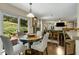 Dining area with an open floor plan that seamlessly blends with the living room and kitchen at 5404 Trumpet Vine Se Trl, Mableton, GA 30126