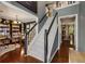 Bright foyer featuring hardwood floors, stairs, and a glimpse of the office and formal living room at 5404 Trumpet Vine Se Trl, Mableton, GA 30126