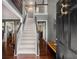 Inviting foyer with hardwood floors, staircase, and elegant decor, showcasing a bright, open entrance at 5404 Trumpet Vine Se Trl, Mableton, GA 30126