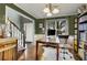 This home office has built-in shelves, a large desk, and warm lighting at 5404 Trumpet Vine Se Trl, Mableton, GA 30126