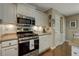 Well-lit kitchen features stainless steel appliances and granite countertops at 5404 Trumpet Vine Se Trl, Mableton, GA 30126