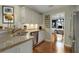 This kitchen has stainless steel appliances, granite countertops, and white cabinets at 5404 Trumpet Vine Se Trl, Mableton, GA 30126
