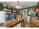 This home office features hardwood floors, a desk, and built-in bookcases at 5404 Trumpet Vine Se Trl, Mableton, GA 30126