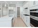 Contemporary kitchen with stainless steel appliances, and a center island at 5611 Meadowstone Walk, Kennesaw, GA 30152