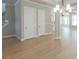 Spacious living room with hardwood floors, staircase and contemporary chandelier at 5611 Meadowstone Walk, Kennesaw, GA 30152