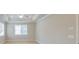 This main bedroom features bright windows, a ceiling fan, and neutral paint at 5611 Meadowstone Walk, Kennesaw, GA 30152