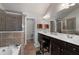 Bathroom featuring a soaking tub, glass-enclosed shower, and double sink at 1222 Lavista Ne Cir, Atlanta, GA 30324