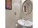 Elegant powder room with pedestal sink and modern fixtures at 1222 Lavista Ne Cir, Atlanta, GA 30324