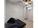 Simple bedroom with carpet, ceiling fan, futon, and natural light from a window, suitable for a guest room or study at 1222 Lavista Ne Cir, Atlanta, GA 30324