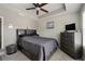 Bedroom with carpet, a ceiling fan, and a dresser with a TV on top at 1222 Lavista Ne Cir, Atlanta, GA 30324