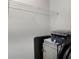 Storage closet features white shelving with items and a white cabinet at 1222 Lavista Ne Cir, Atlanta, GA 30324