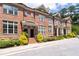 Beautiful brick townhome with mature trees and manicured landscaping at 1222 Lavista Ne Cir, Atlanta, GA 30324