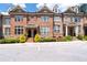 Attractive brick townhome featuring a well-maintained lawn and a welcoming entrance at 1222 Lavista Ne Cir, Atlanta, GA 30324