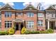 Charming brick townhouse with manicured landscaping and inviting front entrance at 1222 Lavista Ne Cir, Atlanta, GA 30324