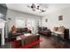 Cozy living room with hardwood floors, plush seating, fireplace, and natural light from windows and door at 1222 Lavista Ne Cir, Atlanta, GA 30324