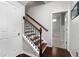 Interior staircase with dark wood steps and railing, connecting to an upper or lower level at 1222 Lavista Ne Cir, Atlanta, GA 30324