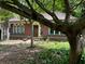 Inviting brick home with a red tile roof and a well-kept yard, framed by mature trees at 1225 Cameron Ne Ct, Atlanta, GA 30306