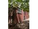 Brick home featuring an exterior door and windows, and a paved driveway, with trees nearby at 1225 Cameron Ne Ct, Atlanta, GA 30306