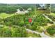 Aerial view of wooded area with lake and homesites featuring lush landscaping and nearby Mulberry Park at 1430 Mineral Springs Rd, Hoschton, GA 30548