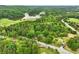 Gorgeous aerial view of the lake community with lush green surroundings at 1430 Mineral Springs Rd, Hoschton, GA 30548