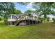 Spacious deck and backyard are perfect for outdoor enjoyment at 1430 Mineral Springs Rd, Hoschton, GA 30548