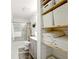 Bathroom featuring a shower, vanity, and built-in shelving for towels and storage at 1430 Mineral Springs Rd, Hoschton, GA 30548