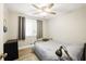 Cozy bedroom with neutral tones, a window, and minimalist decor at 1430 Mineral Springs Rd, Hoschton, GA 30548