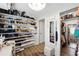 Well-organized walk-in closet featuring custom shelving and storage solutions at 1430 Mineral Springs Rd, Hoschton, GA 30548