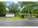 Long paved driveway and detached two car garage at 1430 Mineral Springs Rd, Hoschton, GA 30548