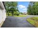 Long paved driveway leading to a charming home and ample parking at 1430 Mineral Springs Rd, Hoschton, GA 30548