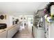 Welcoming entryway showcases wood floors, stylish decor, and a glimpse into the adjacent kitchen and dining area at 1430 Mineral Springs Rd, Hoschton, GA 30548