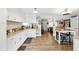 Spacious kitchen featuring granite countertops, white cabinets, and an adjacent breakfast area at 1430 Mineral Springs Rd, Hoschton, GA 30548