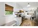 Well-appointed kitchen with white cabinets, granite countertops, stainless steel appliances, and a breakfast nook at 1430 Mineral Springs Rd, Hoschton, GA 30548