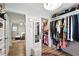 Spacious walk-in closet with ample storage space and a clear view of the adjacent bedroom at 1430 Mineral Springs Rd, Hoschton, GA 30548