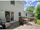 Back deck featuring outdoor seating with a table and greenery, extending from the house at 2458 Zachary Woods Dr, Marietta, GA 30064