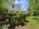 A view of the backyard features plenty of lawn space and a wooden deck at 2458 Zachary Woods Dr, Marietta, GA 30064