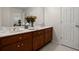 Bathroom with double sinks, wooden cabinets, and ample countertop space at 2458 Zachary Woods Dr, Marietta, GA 30064