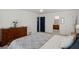 Relaxing bedroom featuring a dresser and a bed with neutral colored bedding at 2458 Zachary Woods Dr, Marietta, GA 30064