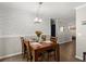 Dining room with wood floors, stylish wallpaper, and a view into the entryway at 2458 Zachary Woods Dr, Marietta, GA 30064