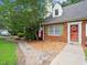 Close up of the brick house with landscaped front yard and a walkway at 2458 Zachary Woods Dr, Marietta, GA 30064