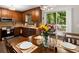 Charming kitchen with wood cabinets, stainless steel appliances, and a sliding glass door to the deck at 2458 Zachary Woods Dr, Marietta, GA 30064