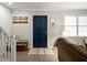 Inviting living room featuring a stylish door and neutral walls and decor at 2458 Zachary Woods Dr, Marietta, GA 30064